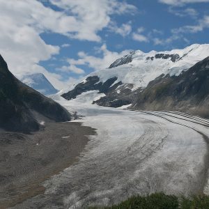 Glacier receding with exposed rock face