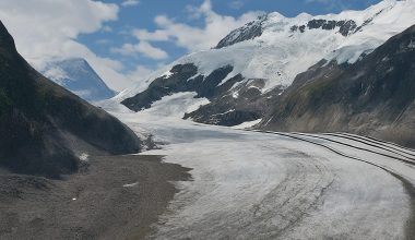 Glacier receding with exposed rock face