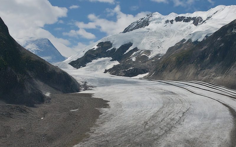 Glacier receding with exposed rock face